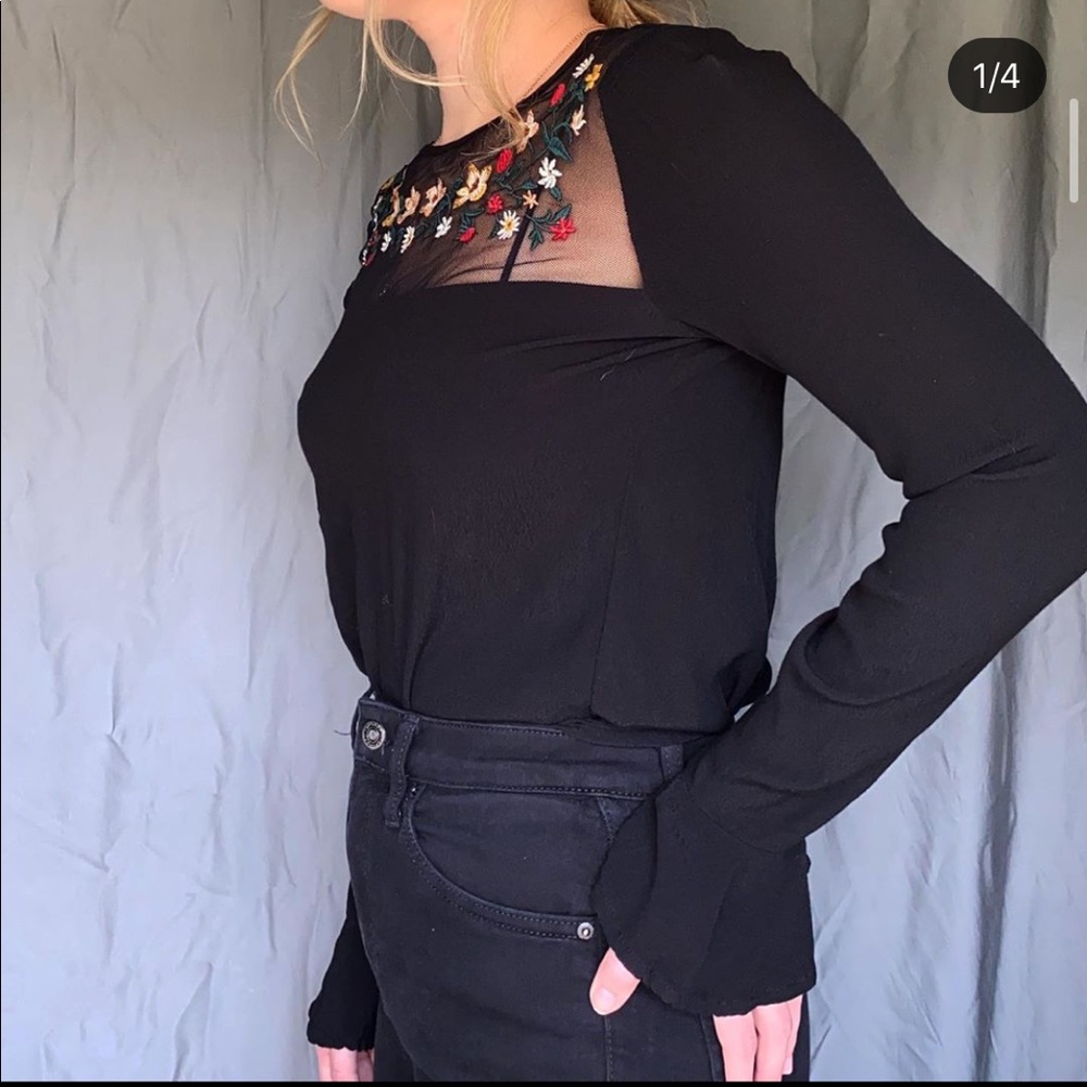 Black long sleeved top embroidered neckline